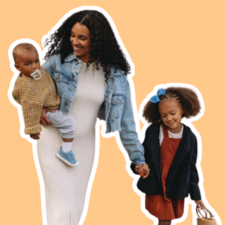 mom carrying baby boy and holding hand of little girl